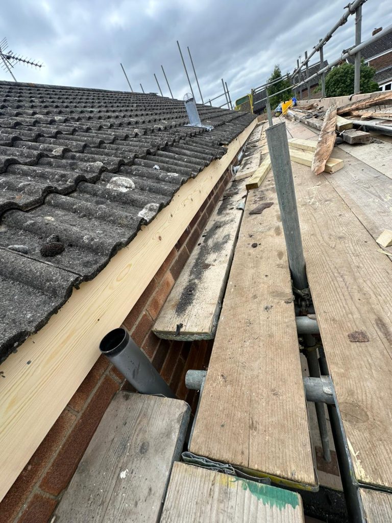 replacing gutters on a house in brighton